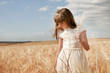 © Luis Carlos Jiménez - girl wearing first communion dress between barley