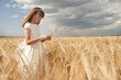 © Luis Carlos Jiménez - girl wearing first communion dress between barley