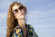 © bartekwardziak - beautiful girl in sunglasses on background blue sky