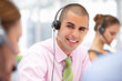 © Monkey Business - Young businessman wearing headset