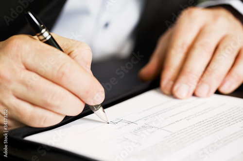Fotografía Close up of businessman signing a contract.