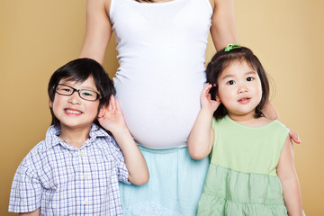 Wall Mural - Pregnant Asian mother and her kids