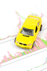 Wall Mural - Toy car and financial graph