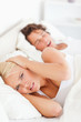 © WavebreakmediaMicro - Portrait of an angry woman awaken by her boyfriend's snoring