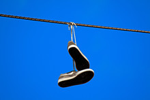 Tennis Shoes Hanging From A Power Line