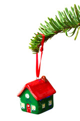 House shape bauble hanging on christmas tree