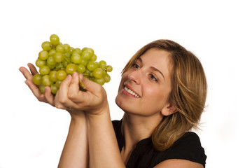 young woman holding green fruit over white background