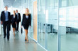 © pressmaster - Businesspeople in corridor