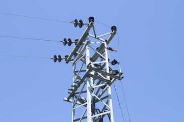 Electrical power lines, transformer, clear blue sky background