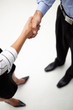 © Monkey Business - Detail businessman and woman shaking hands