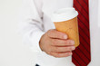 © Monkey Business - Businessman holding takeout coffee