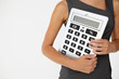© Monkey Business - Young businesswoman with giant calculator
