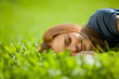 © Nikita Vishneveckiy - girl lying on the grass and sleeping peacefully