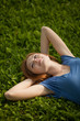 © Nikita Vishneveckiy - girl lying on the grass and smiling
