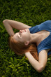 © Nikita Vishneveckiy - girl lying on the grass and sleeping peacefully