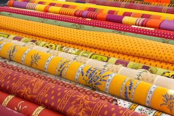 Rolls of fabric on a market stall