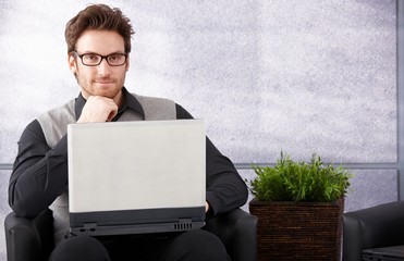 Sticker - Confident businessman with laptop smiling