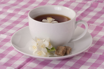 Wall Mural - Jasmine tea and pink tablecloth