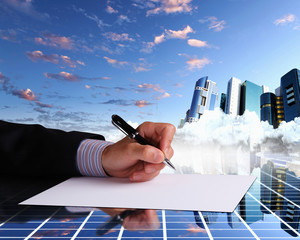 Businessman hand signing documents