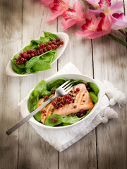 Wall Mural - grilled salmon with redcurrants and fresh spinach