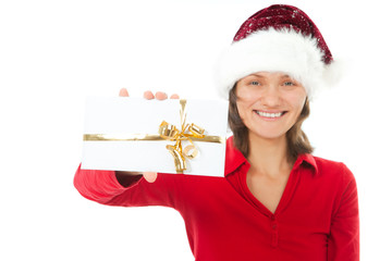 woman with christmas hat holding present on white