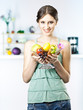 © kikala - beautiful girl holds fruits in the kitchen