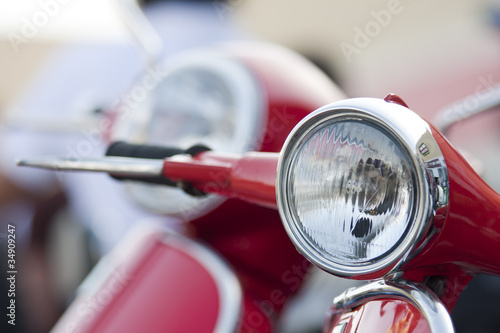 Fotomural Old scooter headlight vs new on the background