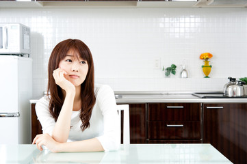 Wall Mural - attractive asian woman in the kitchen