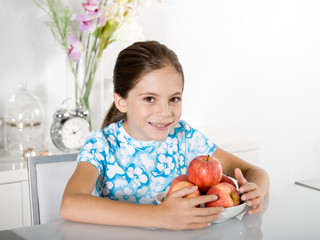 little girl with red apple