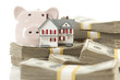 Small House and Piggy Bank with Stacks Money