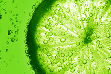 Wall Mural - lime slice in water