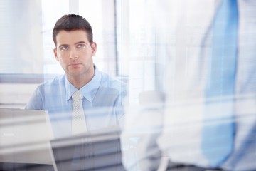 Canvas Print - Casual office worker working in bright office