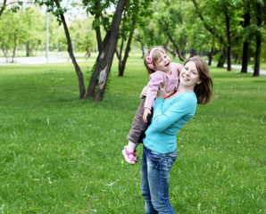 Wall Mural - Portrait of mother with daughter outdoor