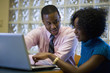 © Steve Prezant/Blend Images - African American businessman working with female co-worker