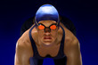 © Pete Saloutos/Blend Images - Serious swimmer in swim cap and goggles