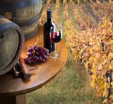 Fototapeta  - red wine with barrel on vineyard