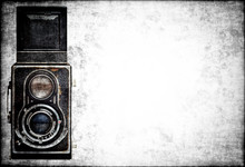 Old  Analog Camera On A Grunge Background