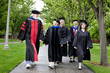 © Eric Raptosh Photography/Blend Images - Professors and students walking to graduation