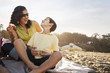© Sollina Images/Blend Images - Mother and son enjoying picnic on beach