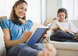 © JGI/Jamie Grill/Blend Images - Mother and daughter reading books