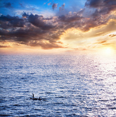 Wall Mural - Fisherman boats catching fish at sunset