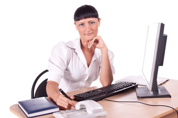 Pretty Caucasian business woman at office desk