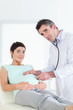 © WavebreakmediaMicro - Doctor examining a pregnant woman with a stethoscope