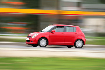 Wall Mural - speedy red compact car