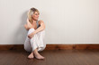 © Darrin Henry - Beautiful young blonde woman sitting on floor