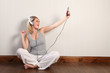 © Darrin Henry - Beautiful blonde girl singing to music at home