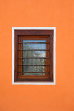 Wooden Window On Orange Cement Wall