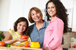 © Monkey Business - Mother,daughter and grandmother cooking