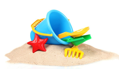 children's beach toys and sand isolated on white