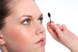 © Darrin Henry - Beautiful girl using eye lash separator brush